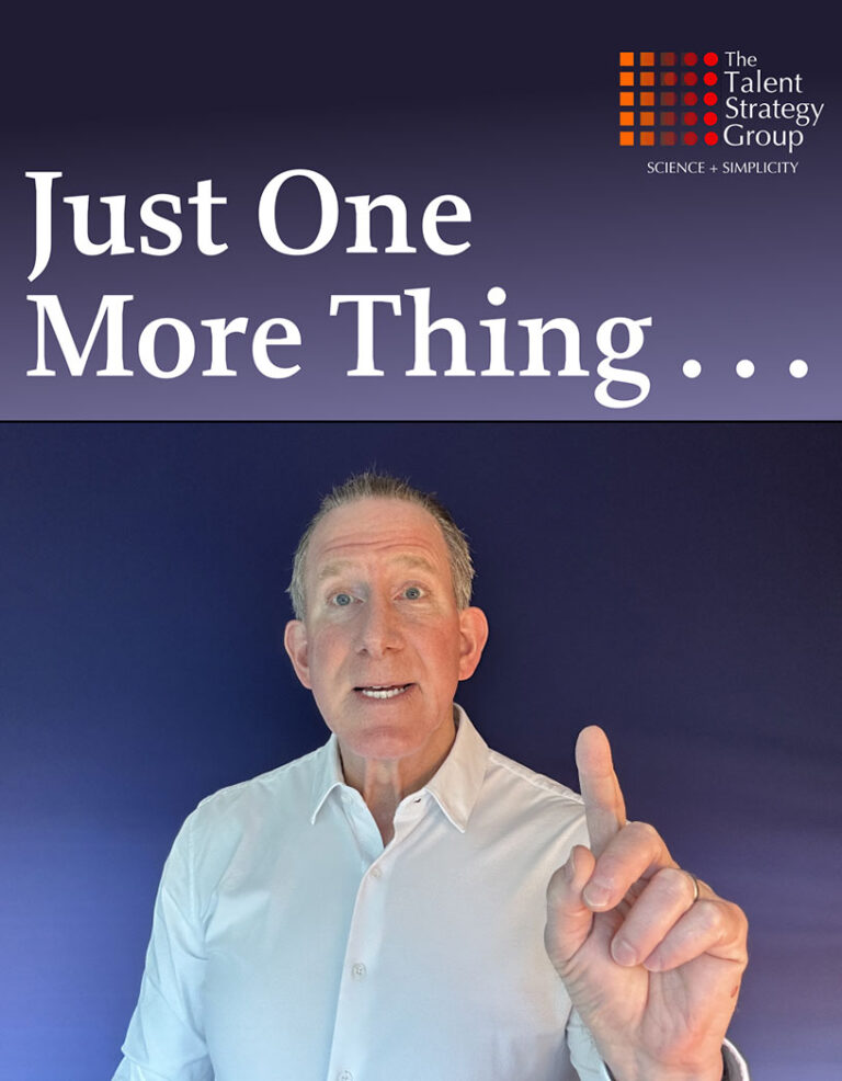 A person in a white shirt stands against a dark blue background, pointing upwards with their right index finger. The text above reads, "Just One More Thing..." alongside the logo for The Talent Strategy Group.